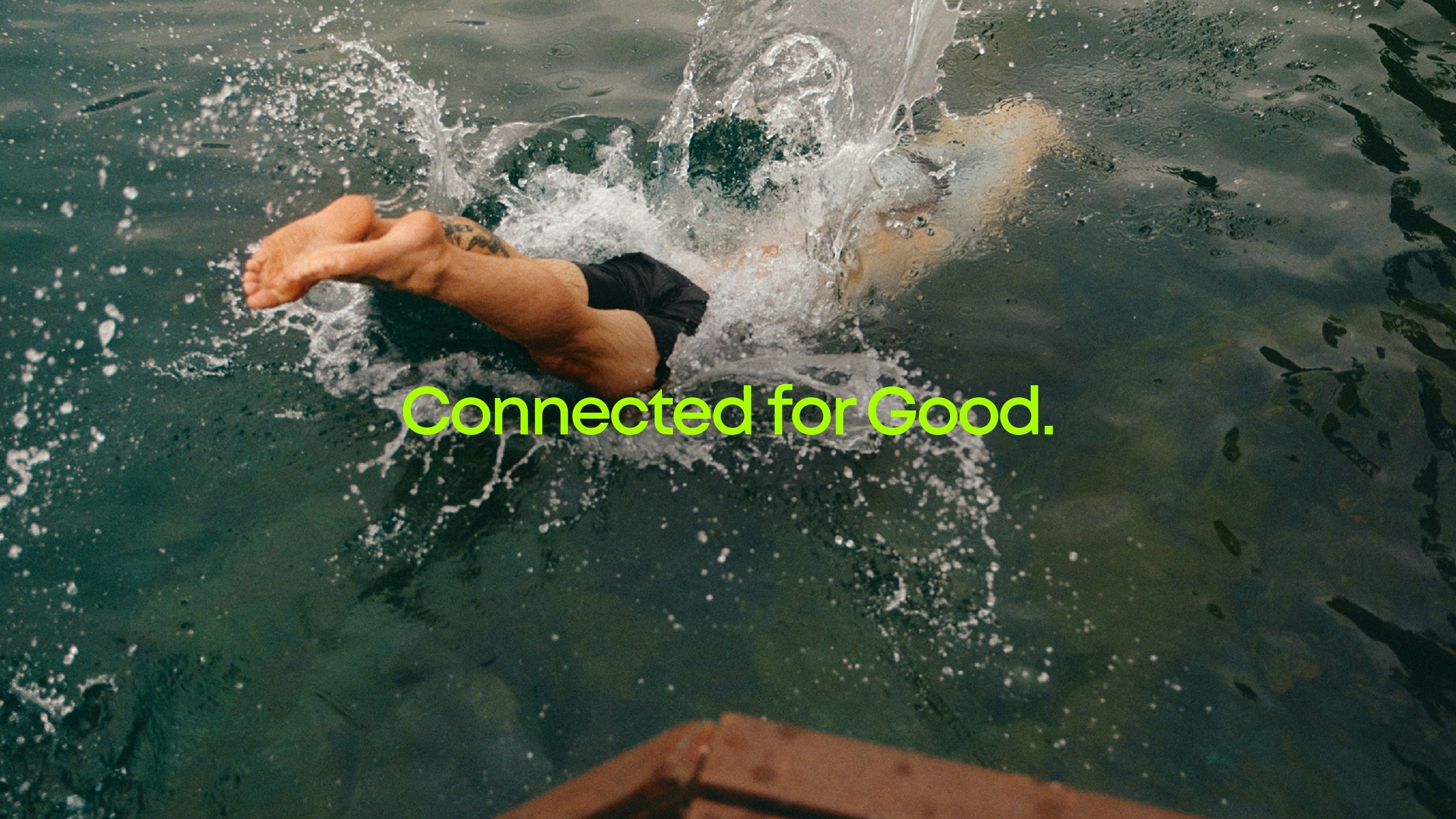Connected for Good brand campaign showing a child swimming